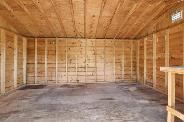 Spacious, empty shed with high ceilings, ready for your storage or creative projects.