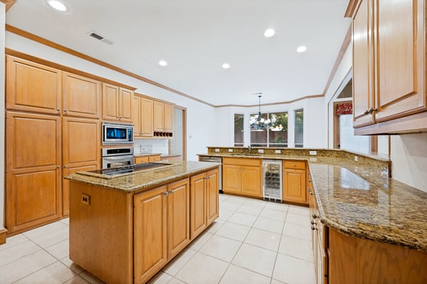 Spacious kitchen featuring abundant cabinetry, new appliances, and ample counter space for cooking and entertaining.