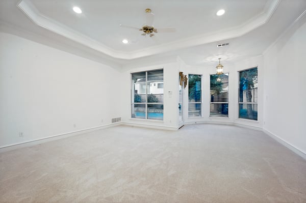 Spacious primary bedroom with natural light and easy access to outdoor space.