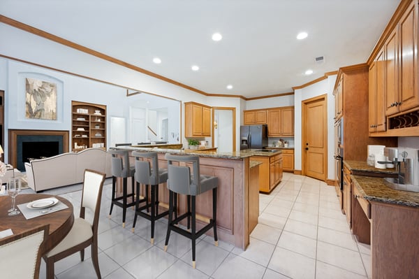 Spacious kitchen and dining area feature modern appliances, ample storage, and a welcoming layout for gatherings.