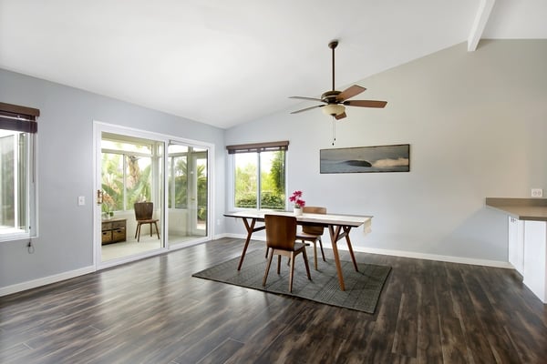 Light filled dining area with beautiful hardwood floors.