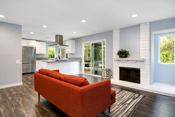 Kitchen flows into living room.