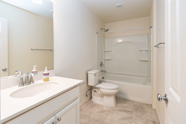 Well-maintained bathroom features a bathtub, modern fixtures, and a spacious vanity for convenience.