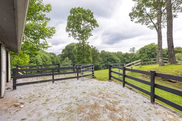 Discover a spacious outdoor area with fenced paddocks, perfect for equestrian activities or gardening.