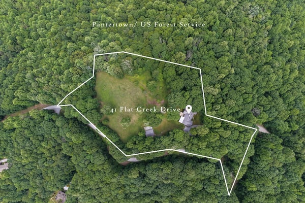 Discover this unique property nestled in lush greenery, offering ample space for outdoor adventures and privacy.