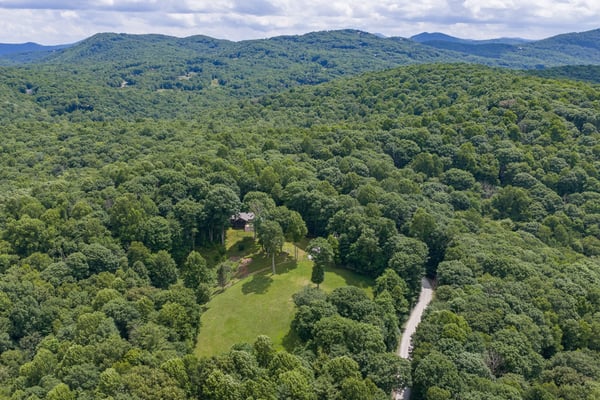 Discover this expansive, wooded retreat, perfect for secluded living or creating your dream escape.