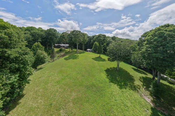 Spacious, gently sloping land surrounded by trees, perfect for building your dream home or getaway.