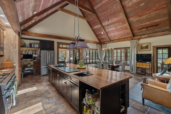 This spacious kitchen features vaulted ceilings and a large island, perfect for entertaining and family gatherings.