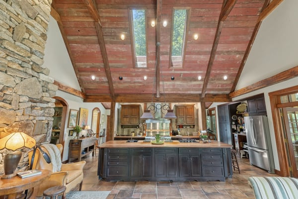 This expansive kitchen features vaulted ceilings, abundant natural light, and a spacious island perfect for entertaining.
