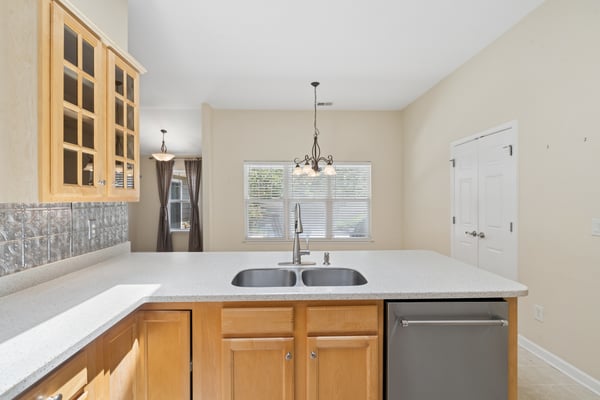 Kitchen with granite countertops and double sink