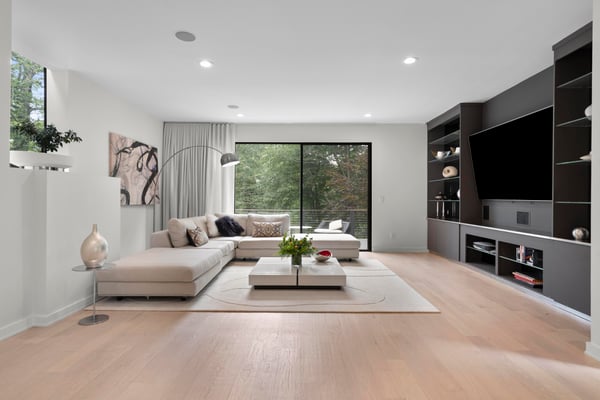 Spacious living area with ample natural light, featuring modern designs and a seamless indoor-outdoor connection.