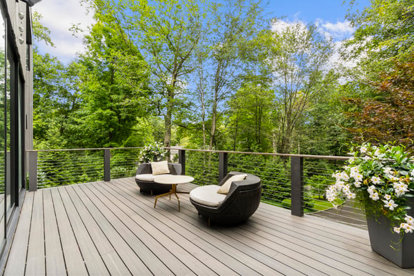 This inviting outdoor space features comfortable seating amidst lush greenery, perfect for relaxation and entertaining.