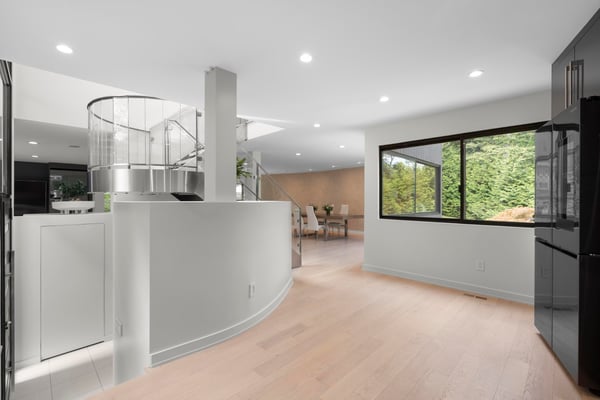 Bright and open living space featuring modern architecture and large windows that invite natural light.