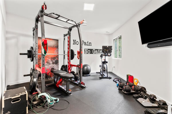 Discover a dedicated home gym featuring high-quality equipment for intense workouts and fitness enthusiasts.