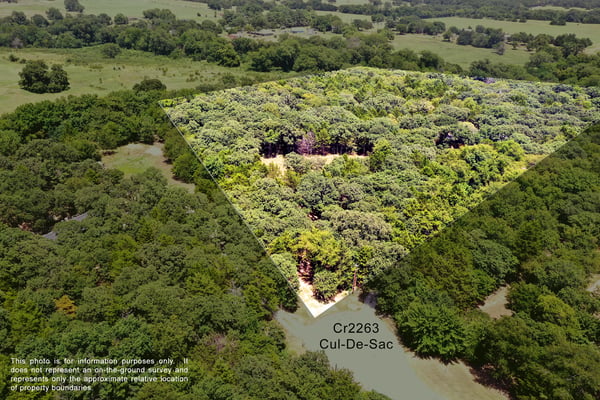 PROPERTY AERIAL...Beautiful Heavily Wooded 5+ Acre Lot With A Cleared Homesite And A Creek Along The Back. Property Outlines Are Approximate