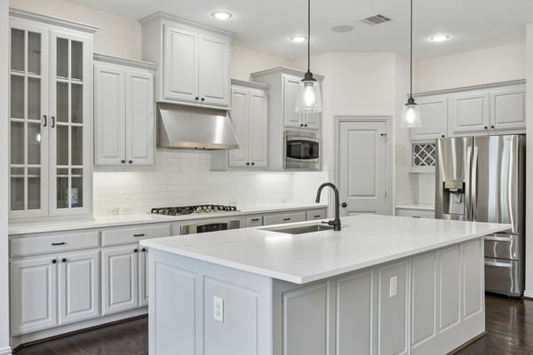 Kitchen with quartz countertops and large island