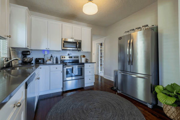 This well-appointed kitchen features modern appliances and ample counter space, perfect for culinary enthusiasts.