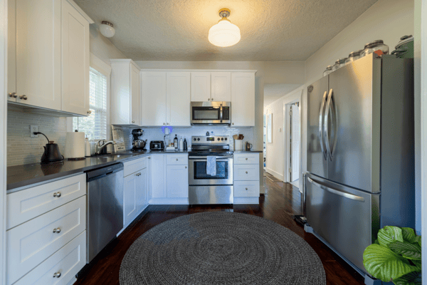 Bright, functional kitchen featuring stainless steel appliances, ample storage, and a cozy dining area.