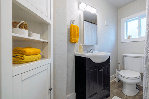 Bright bathroom featuring modern fixtures, ample storage, and warm tones for a welcoming atmosphere.