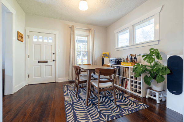 Bright dining area featuring natural light, modern decor, and a cozy atmosphere perfect for gatherings.