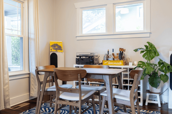 Bright dining area featuring natural light, modern furnishings, and a cozy atmosphere perfect for gatherings.
