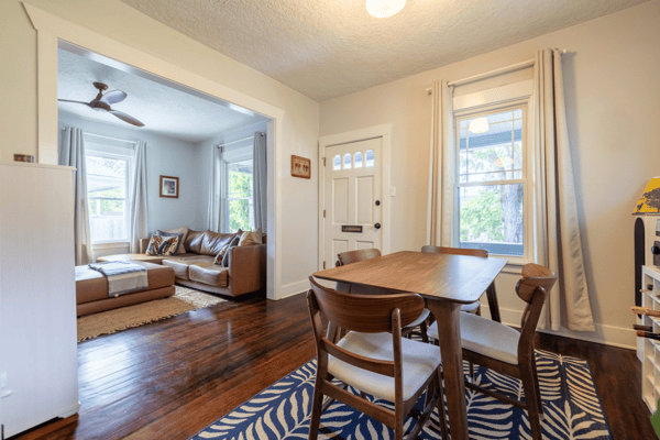 Bright and inviting open layout featuring a cozy living area and dining space, perfect for gatherings.