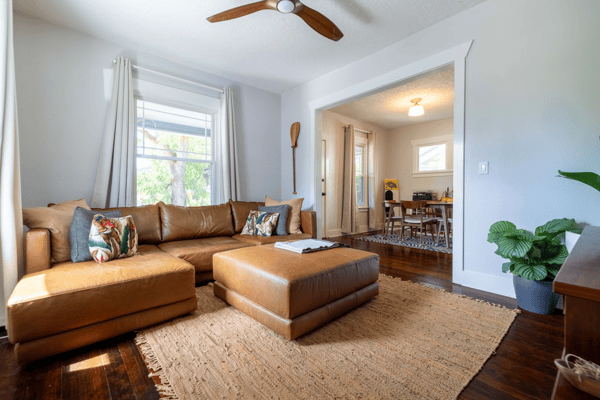 Bright and inviting living space features modern furnishings, abundant natural light, and a convenient open layout.