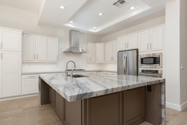 Island with Blue Moon Quartzite and breakfast bar seating