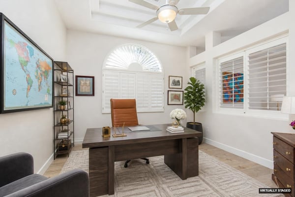 Downstairs office with double door entry and plantation shutters open to living room