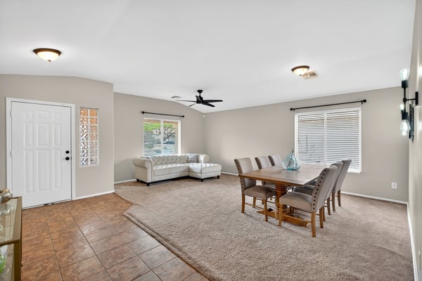 Large living and dining space with high ceilings and natural light. Flexible layout supports entertaining and comfortable living in Casa Grande.