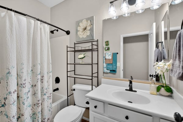Full bathroom featuring a tub and shower combo with clean finishes. Designed for functionality and ease in Casa Grande.