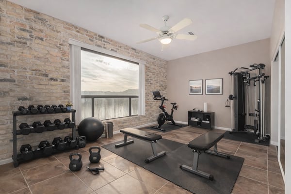 Versatile bedroom featuring a built-in Murphy bed with integrated shelving, maximizing functionality and storage. Ideal as a guest room, office, or multipurpose living space within this Fountain Hills home.