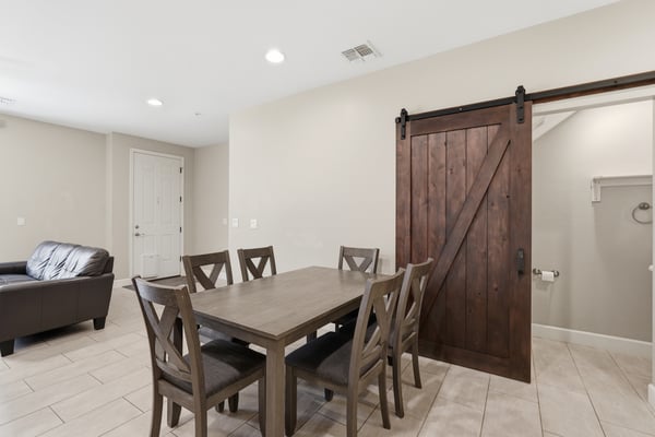 Dedicated dining area featuring stylish finishes and a decorative barn door accent. Perfect for everyday meals, holiday gatherings, and entertaining guests.