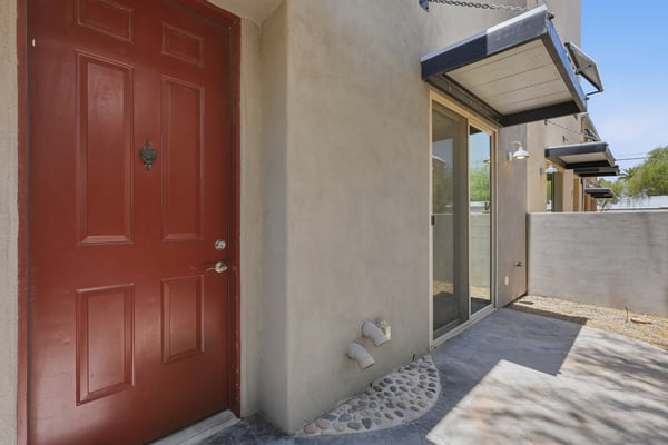 Private outdoor patio area with covered entry and direct access to the home's interior. A great extension of the living space for relaxing and enjoying the outdoor environment.