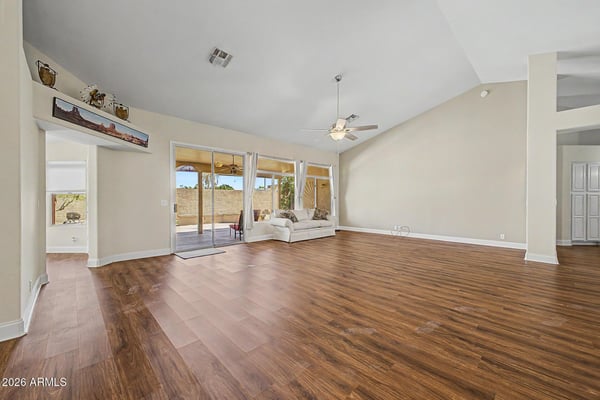 Enjoy flexible living and entertaining space with backyard views, vaulted ceilings, and abundant natural light. Neutral finishes and spacious dimensions allow buyers to easily envision their personal style.