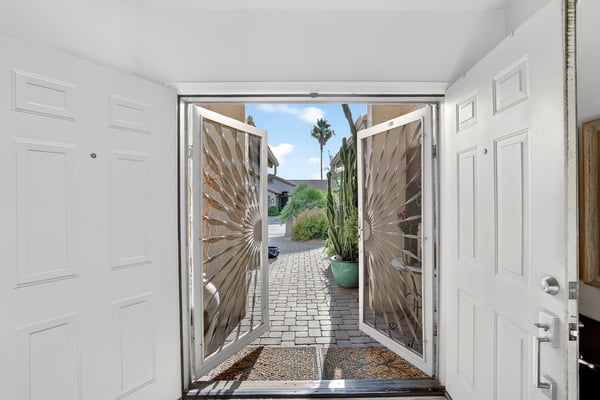 The welcoming foyer showcases abundant natural light and a bright, open feel from the moment you step inside. Thoughtful design elements create a seamless transition into the home's living spaces.