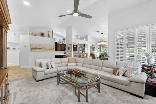 Designed for both comfort and entertaining, this spacious great room features soaring ceilings, neutral finishes, and excellent natural light. The versatile layout accommodates a variety of furniture arrangements.