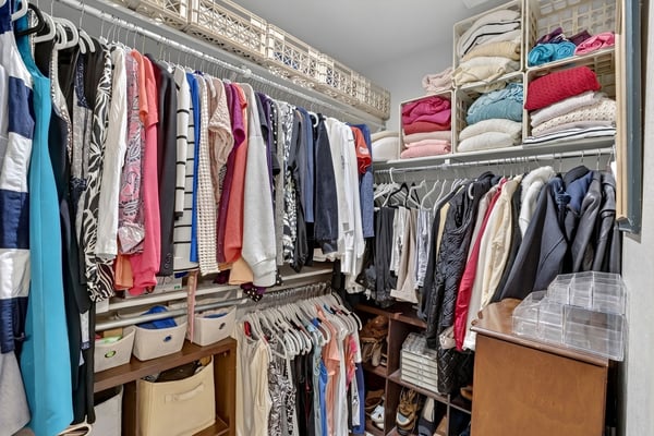 Enjoy exceptional storage in this walk-in closet complete with built-in shelving, hanging areas, and organized compartments. Designed to keep wardrobes and accessories neatly arranged.