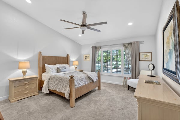Large windows, neutral d cor, and generous proportions make this primary bedroom both comfortable and inviting. The room offers excellent flexibility for furniture placement and personal style.