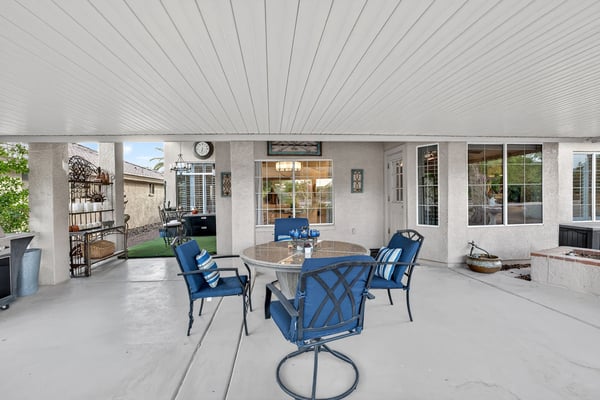 This spacious covered patio creates the ideal environment for outdoor dining and social gatherings. Durable finishes and shaded comfort make it a standout backyard feature.