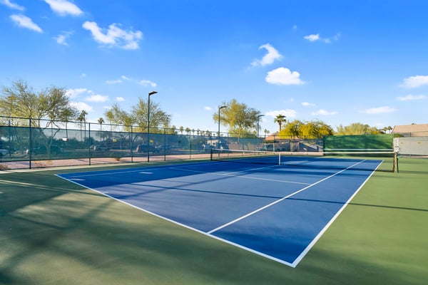 Well-maintained tennis courts provide excellent opportunities for exercise, friendly competition, and outdoor recreation within the community's amenity-rich setting.