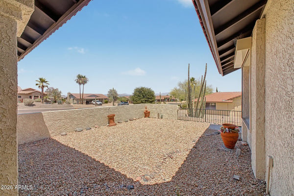 Relax and enjoy the beauty of Fountain Hills from this inviting front outdoor space. The combination of mountain views, desert landscaping, and privacy creates a peaceful environment to unwind.