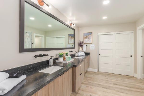 Luxurious primary bath with dual sinks, modern cabinetry, expansive counter space, and updated fixtures. A thoughtfully designed Scottsdale retreat offering both elegance and functionality.