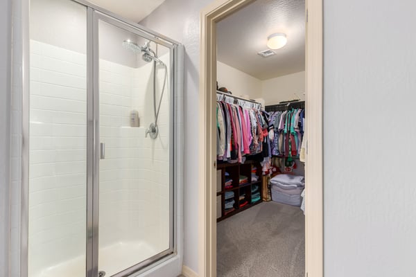 Enjoy a large walk-in closet alongside a separate walk-in shower in the primary suite, offering exceptional storage, convenience, and functionality for everyday living.