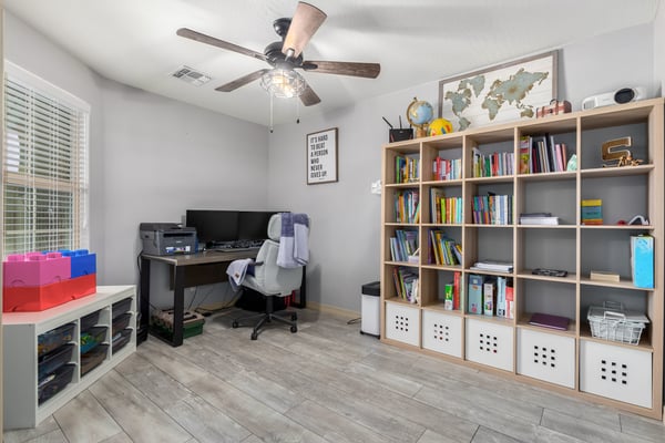 Bright and versatile, this bonus room offers endless possibilities as a home office, study area, craft room, or playroom. Updated flooring, ceiling fan, and natural light create a comfortable workspace.