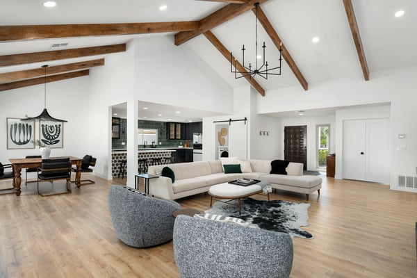 Spacious living areas blend beautifully with the dining room and gourmet kitchen, creating an inviting setting enhanced by modern updates, vaulted ceilings, and an abundance of natural light throughout.