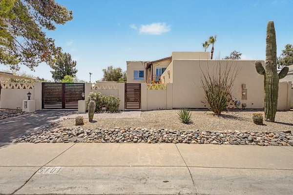 Beautiful Southwestern architecture, gated privacy, and professionally landscaped desert surroundings create an unforgettable first impression. The home's clean lines and inviting fa ade perfectly complement its Scottsdale setting.