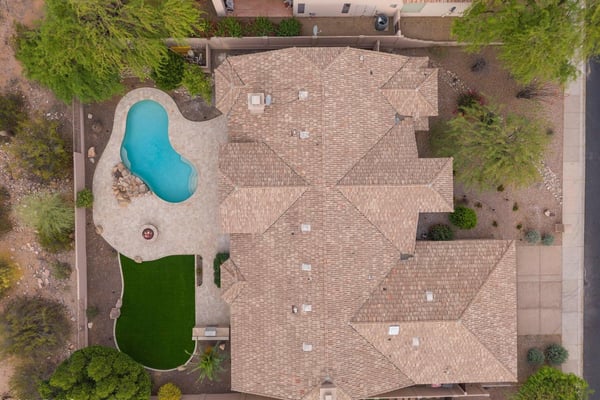 Overhead aerial displaying the home's impressive footprint, private backyard retreat, resort-style pool, entertaining patio, and professionally landscaped outdoor spaces in Scottsdale.