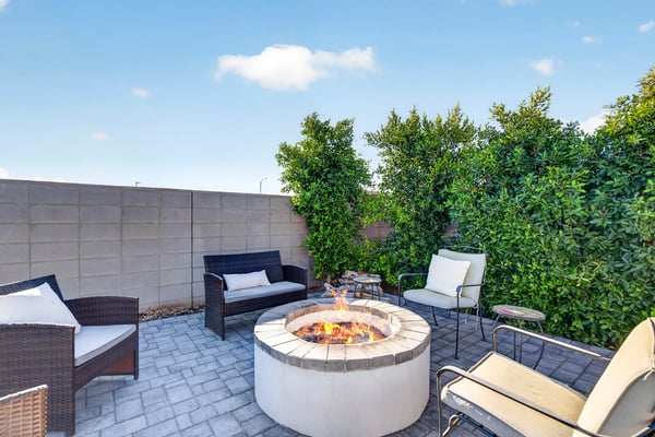 Relax with family and friends around the custom fire pit surrounded by attractive pavers, mature landscaping, and a private hot tub. This outdoor retreat is perfect for enjoying beautiful Arizona evenings.