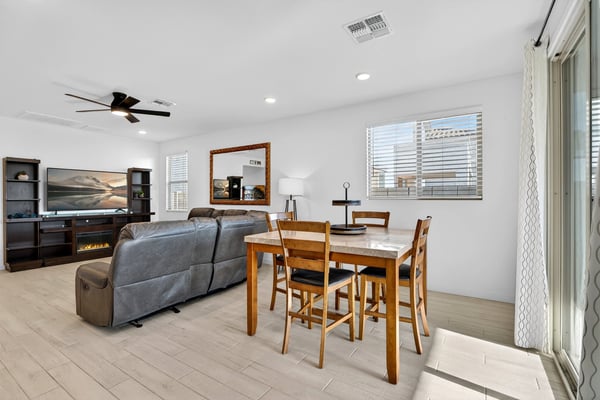 The dining area blends beautifully with the great room, offering an open-concept layout perfect for hosting guests while enjoying natural light and comfortable everyday living.